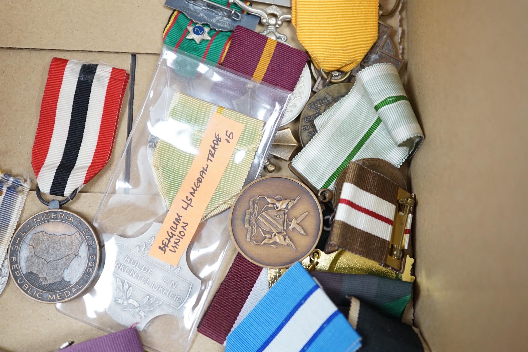 Thirty world military and commemorative medals including; a Belgium War Aid Medal 1914-18, Nigeria Republic Medal, Austri-Hungarian Medal for Bravery, Kuwaiti Liberation Medal, Pakistan Resolution Day Medal, etc.